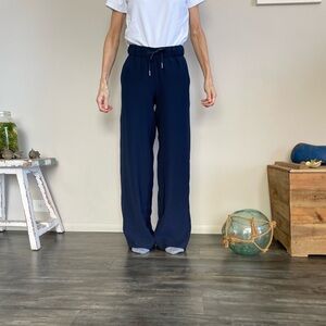 Lululemon, wideleg, long, navy blue pants. The model is 5”3. Worn with care.